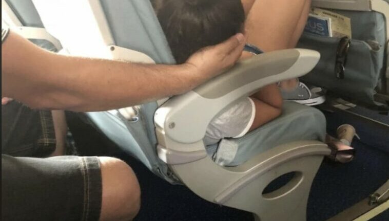 Dad Sparks Online Debate After Cradling Daughter’s Head For 45 Minutes So She Could Sleep During A Flight